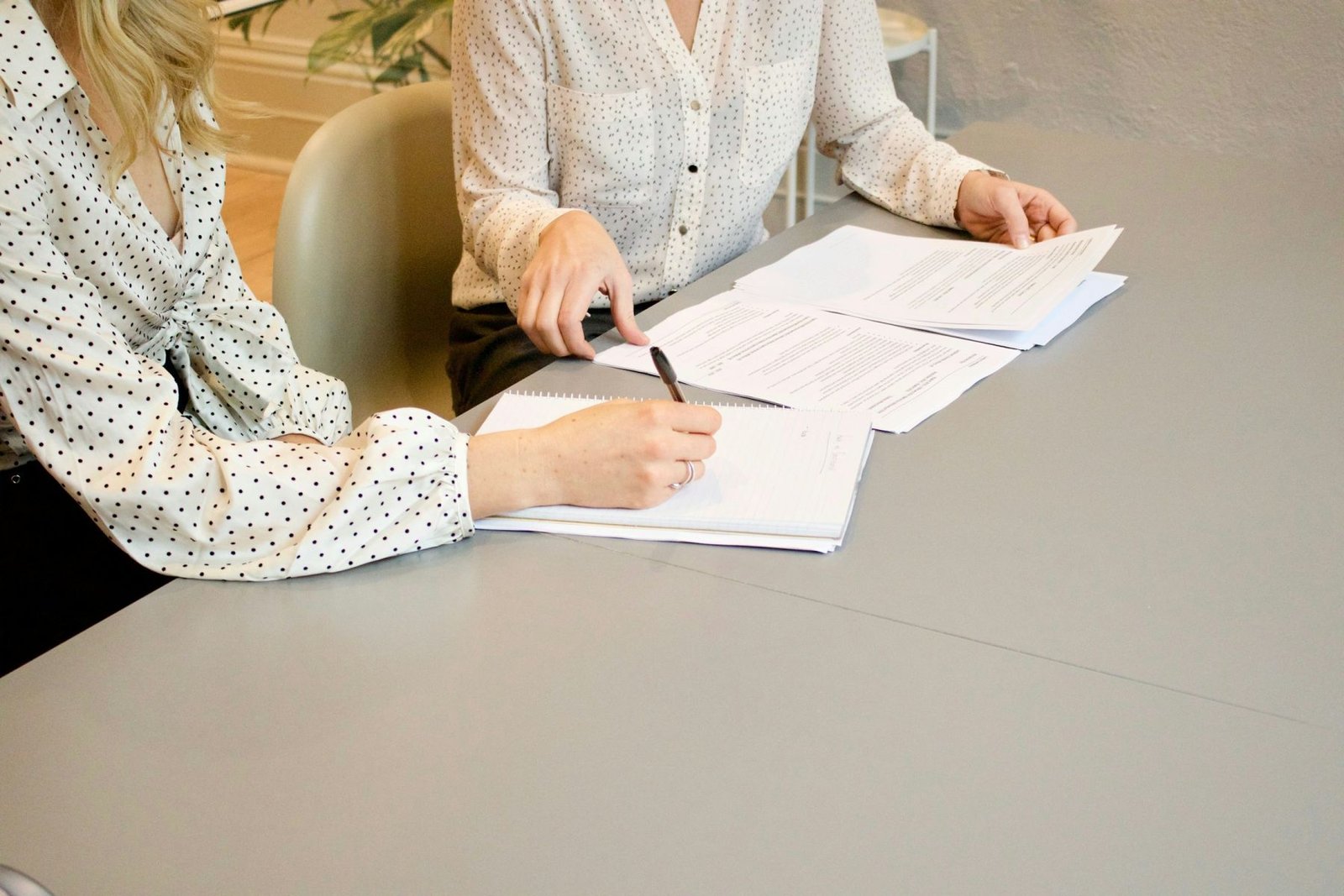 Business documents being reviewed and signed